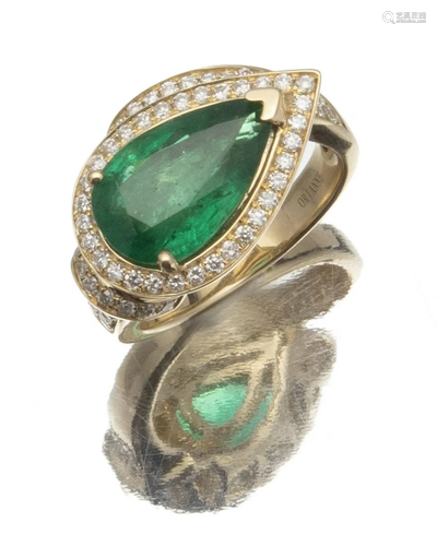 An emerald and diamond ring