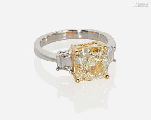 A light yellow diamond ring