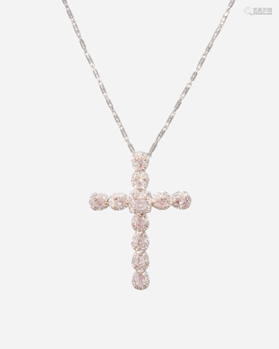 A pink colored and near colorless diamond cross pendant