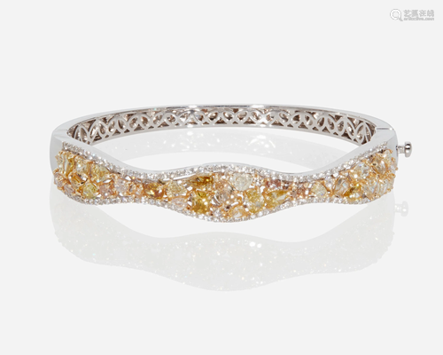 A colored and near colorless diamond hanged bangle