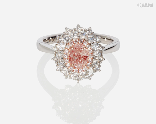 A natural fancy orangy pink and near colorless diamond