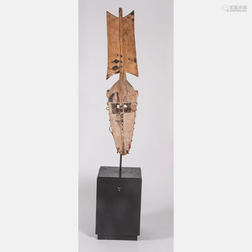 An African Carved and Painted Wood Bobo Mask on Stand