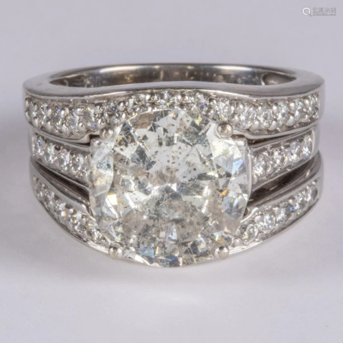 An 18kt White Gold and Diamond Engagement Ring, Joined