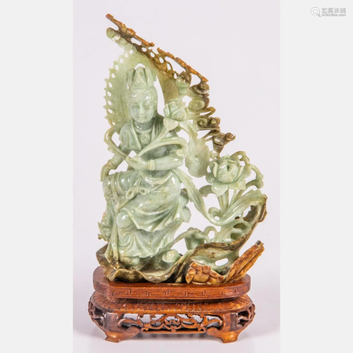 A Chinese Carved Russet Jade Figure Depicting Guanyin,