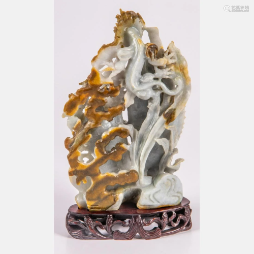 A Chinese Carved Russet Jade Figural Group Depicting