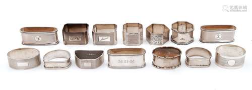 Fourteen Edwardian and later silver napkin rings, various ma...