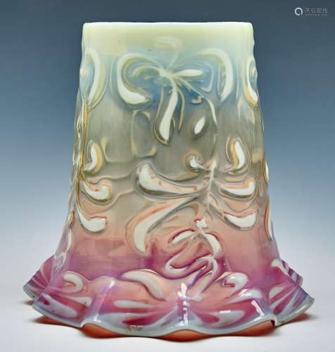 A cranberry tinted semi opalescent moulded glass oil lampsha...