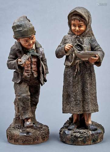 A pair of Bohemian cold painted terracotta figures of childr...