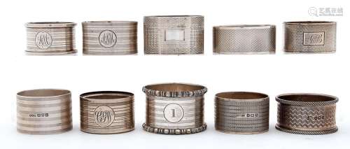 Eleven Edwardian and later silver napkin rings, various make...