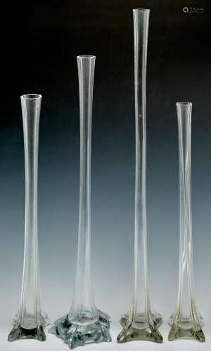 Four similar glass lily vases, 20th c, 49.5 - 70.5cm h Undam...