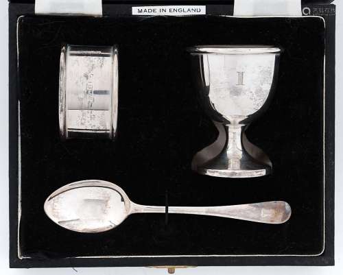 An Elizabeth II silver christening set of egg cup, spoon and...