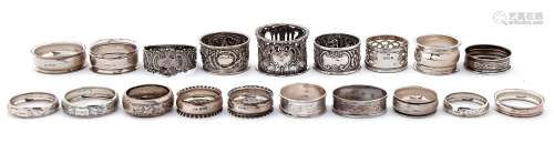 Nineteen Victorian and later silver napkin rings, including ...