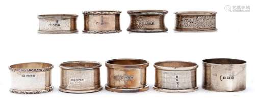Nine Edwardian and later silver napkin rings, various makers...
