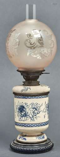 A Victorian pottery oil lamp, the cylindrical body and fount...