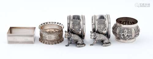 A pair of Edwardian EPNS seated fox napkin rings, another, a...