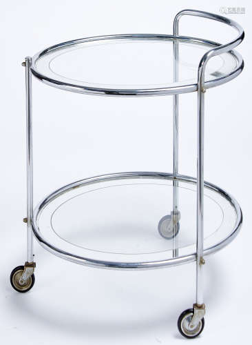 A tubular oval chromium plated and glass two tier trolley, m...