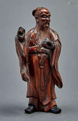 A Chinese carved wood figure of Shou-Lao, 19th / 20th c, 17....