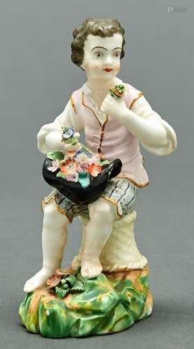 A Derby figure of a seated boy with flowers, c1800, on an up...