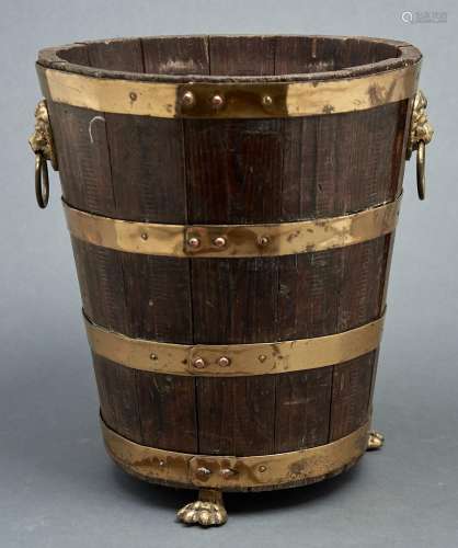 A brass bound oak bucket, elements 19th c, with lion mask ha...