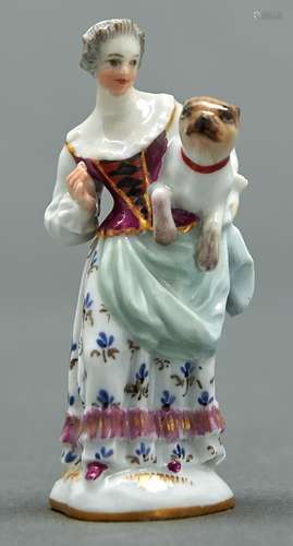 A Meissen miniature figure of a lady carrying a pug dog, 19t...