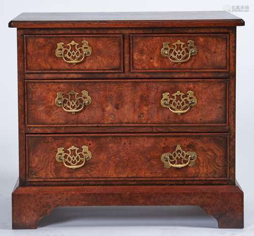 A reproduction burr elm veneered small chest of drawers, box...