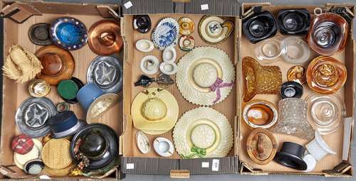 A collection of ceramic, glass, wood and metal top hats, tri...