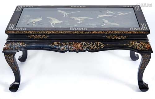 A reproduction black lacquer coffee table in Chinese style, ...