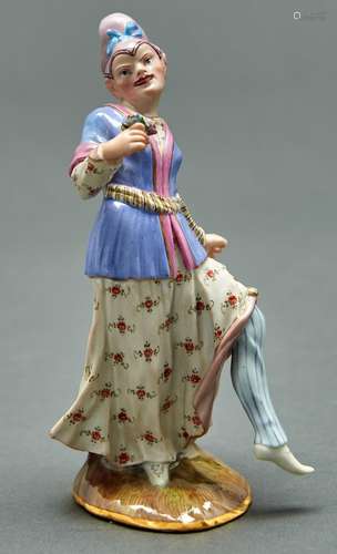 A Meissen chinoiserie figure of a male dancer, 19th c, on fl...