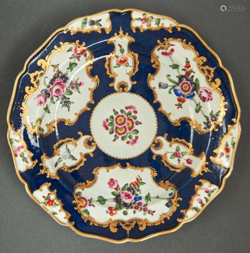 A Worcester scale blue ground plate, c1770, painted with flo...