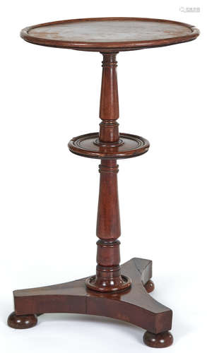 A Victorian mahogany dumb waiter, the dished top on turned p...