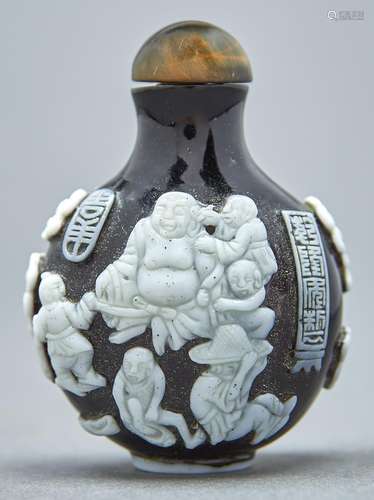 A Chinese cameo glass snuff bottle, 20th c, of intense ruby ...