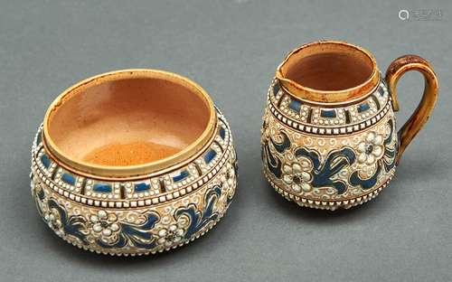 A Doulton ware cream jug and sugar bowl, by Francis E Leigh,...