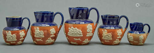 A graduated set of five Royal Doulton jugs, late 19th c, dec...