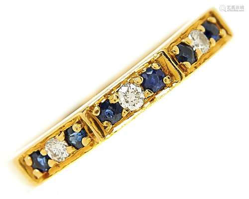 A nine stone sapphire and diamond ring in 18ct gold, London ...
