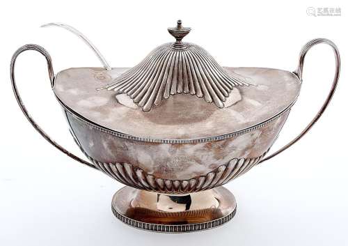 A George V silver soup tureen and cover, of partly reeded ov...