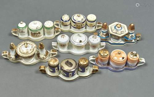 Seven Noritake condiment sets, early 20th c, each on two han...