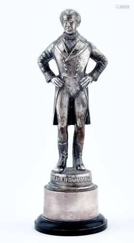 A silver plated brass statuette of Stewart Grainer, in the r...