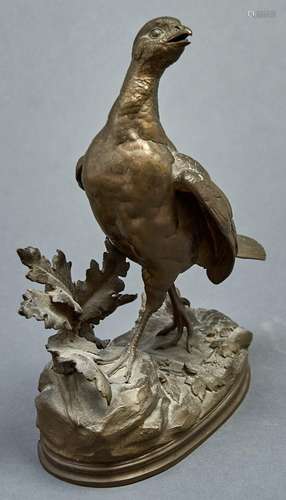 An animalier bronze sculpture of a grouse, cast from a model...