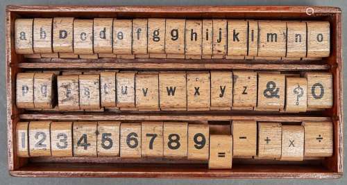 A set of varnished wood and rubber letter and number printin...