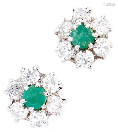 A pair of emerald and diamond cluster earrings, in 18ct whit...