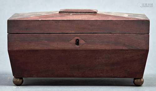 A Regency mahogany sarcophagus shaped tea caddy, the top wit...