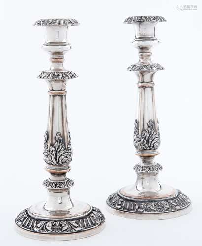 A pair of Sheffield plate candlesticks, c1830, applied with ...