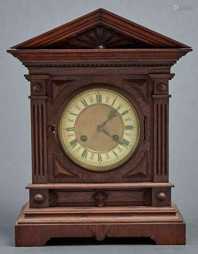 A late Victorian oak cased mantel clock, c1890, the flared a...