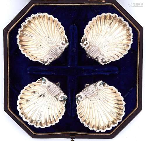 A set of four Victorian silver scallop shell salt cellars, o...