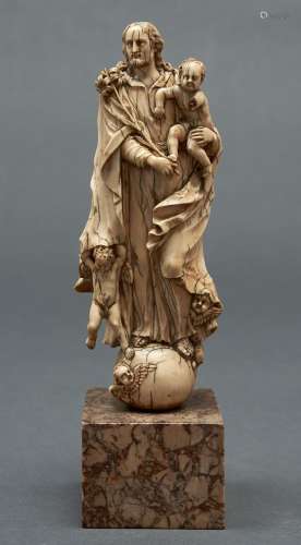 A Portugese ivory carving of St Joseph with the Christ Child...