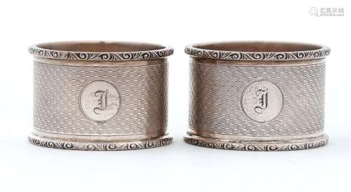 A pair of George VI silver napkin rings, engine turned, by C...