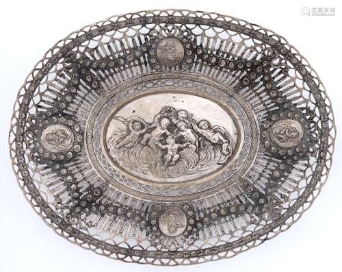 A German oval silver dish, c1900, embossed to the centre wit...