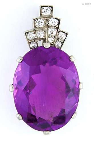 An amethyst and diamond pendant, in white gold coloured meta...