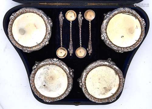 A set of four Victorian silver salt cellars crisply chased w...