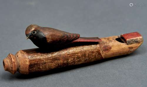 A polychrome soft wood bird shaped whistle, probably first h...